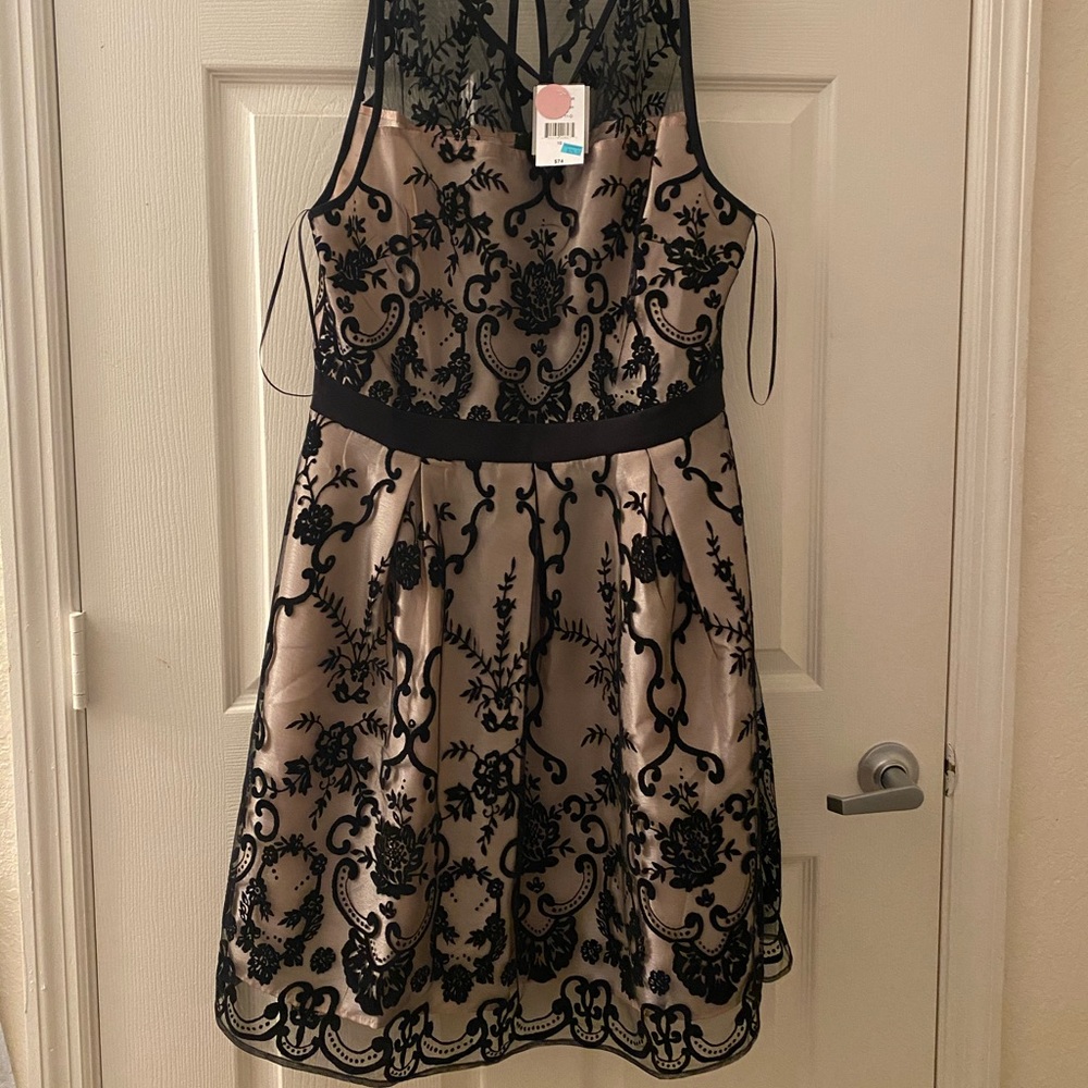 A semi-formal dress that has never been worn.